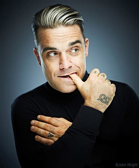 The Charismatic Personality of Robbie Williams: A Perfect Blend of Magic and Talent